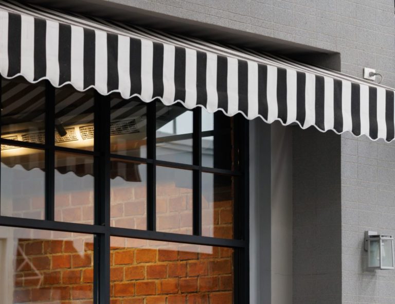 black and white awning over shop window