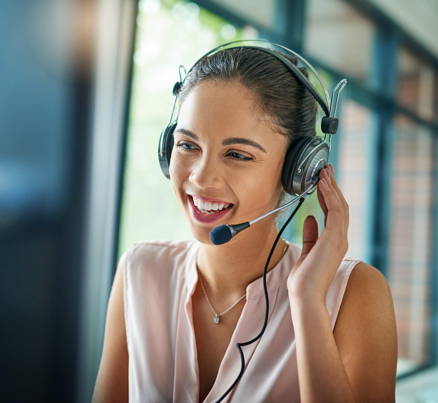 call handler smiling whilst speaking to customer